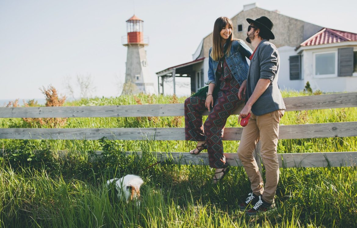 young-stylish-hipster-couple-love-walking-with-dog-countryside_285396-1354